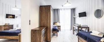 Фото номера Двухместный номер с 2 отдельными кроватями Курортные отели OW Posejdon Dźwirzyno г. Дзвижино 8
