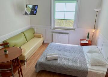 Фото номера Стандартный трехместный номер-студио Апартаменты Apartamenty i Pokoje Magnolia г. Дзвижино 47
