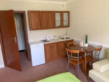 Фото номера Стандартный трехместный номер-студио Апартаменты Apartamenty i Pokoje Magnolia г. Дзвижино 33